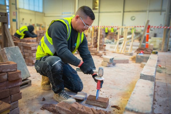 Business donates 20,000 bricks to students at building college